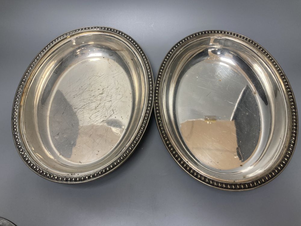 A pair of silver plated oval entree dishes, with covers and detachable handles, 29cm